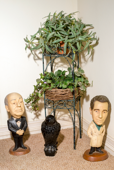 Figurines of director Alfred Hitchcock, a reproduction of the Maltese Falcon, and actor Humphrey Bogart, star of the 1941 version of the Warner Bros. film The Maltese Falcon